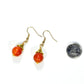 12mm Natural Carnelian Crystal Drop Earrings beside a dime.