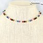 4mm Chakra Gemstone Choker Necklace displayed on a bust.