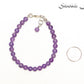 6mm Amethyst Crystal Bracelet beside a dime.