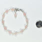6mm Rose Quartz Link Bracelet beside a dime.