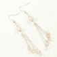 Top view of Cascading Rose Quartz Crystal Drop Earrings.