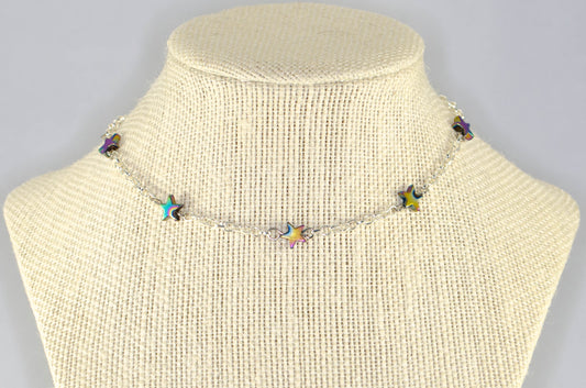 Rainbow Hematite Star and Chain Choker Necklace displayed on a bust.