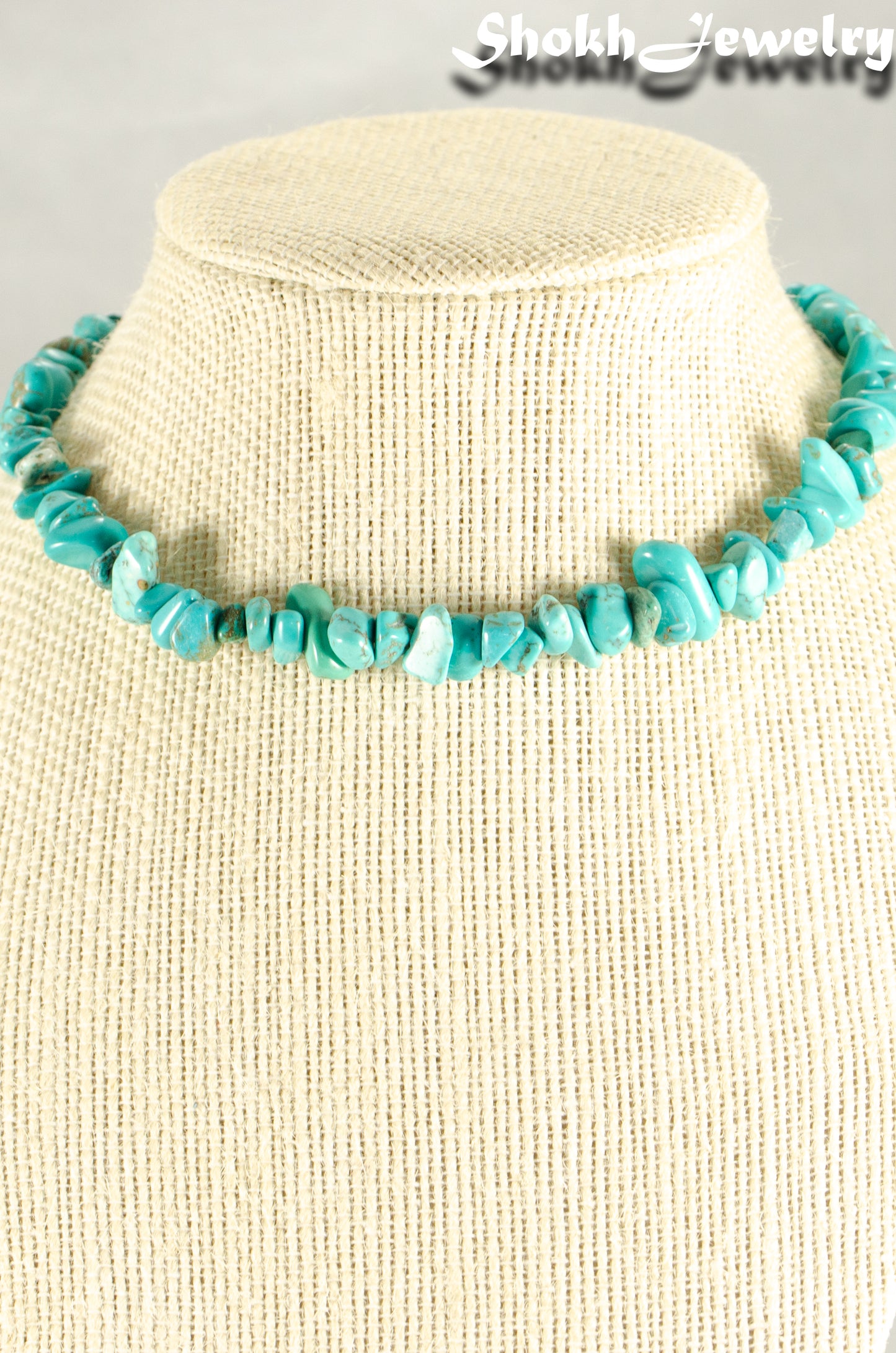 Natural Turquoise Crystal Chip Choker Necklace displayed on a bust.