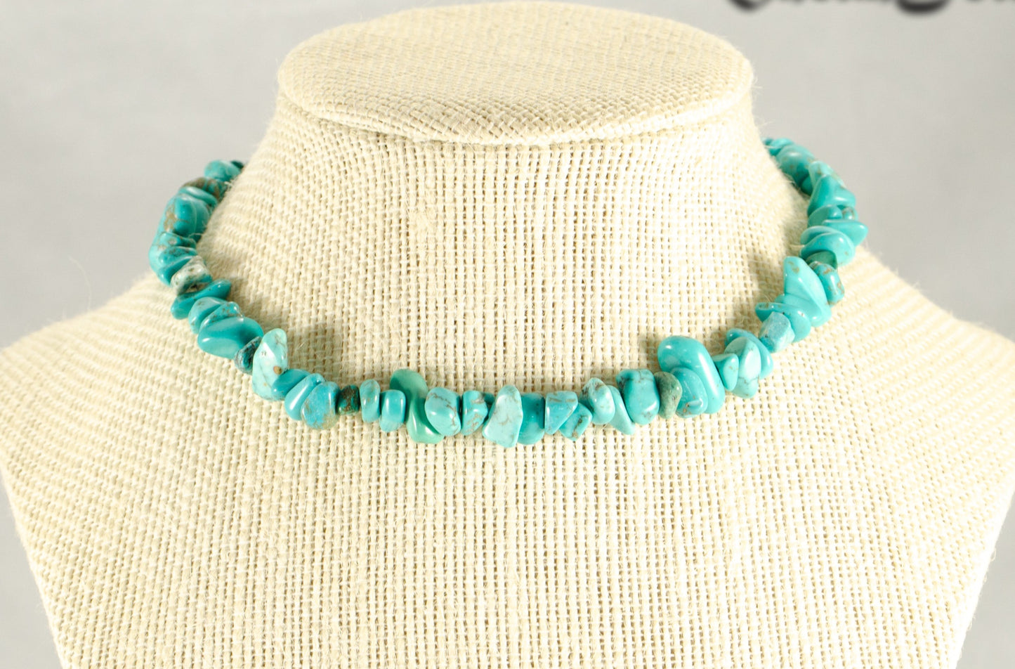 Natural Turquoise Crystal Chip Choker Necklace displayed on a bust.