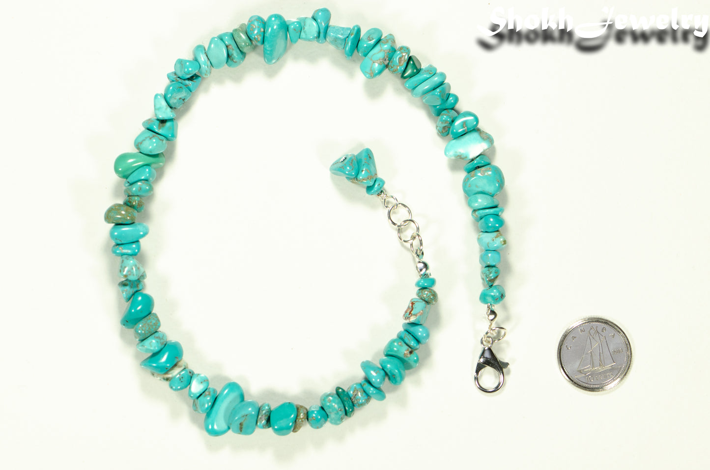 Natural Turquoise Crystal Chip Choker Necklace beside a dime.