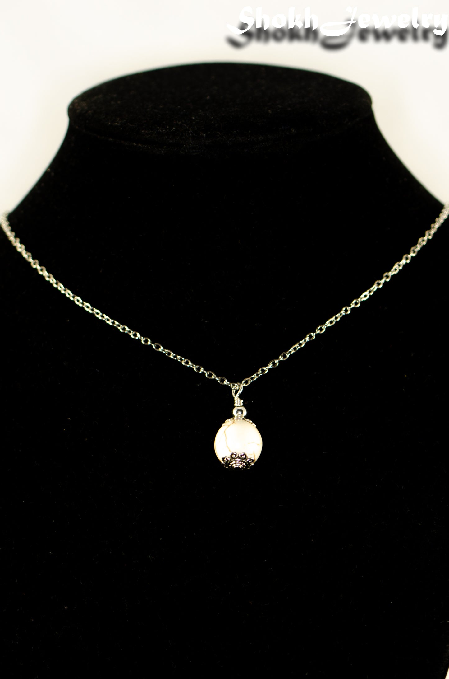 12mm White Howlite Pendant Necklace displayed on a bust.