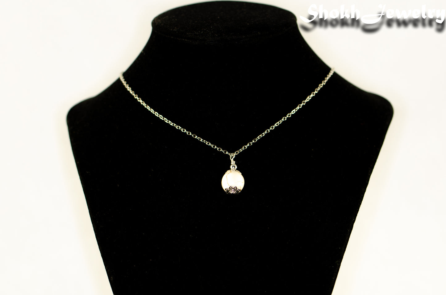 12mm White Howlite Pendant Necklace displayed on a bust.