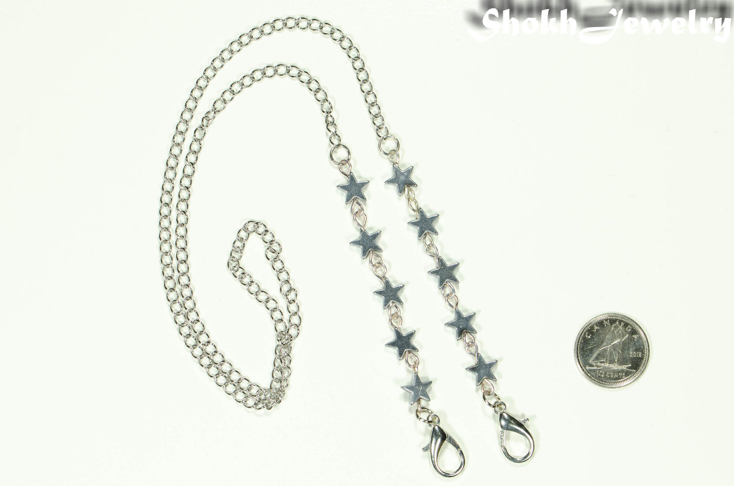 Silver Hematite Star Eyeglass Chain beside a dime.