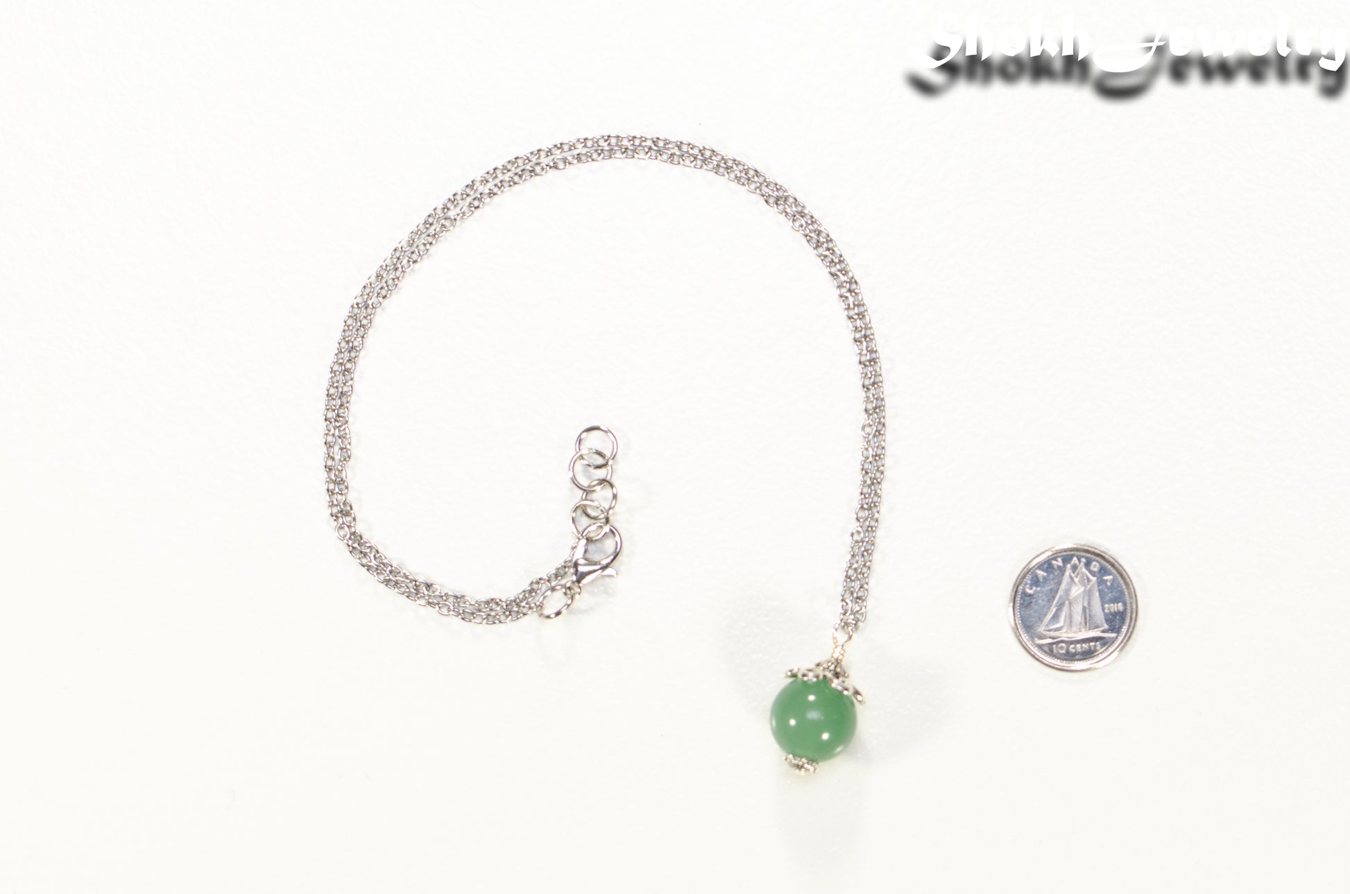 12mm Green Aventurine Pendant Necklace beside a dime.