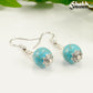 Close up of 12mm Turquoise Howlite Dangle Earrings.
