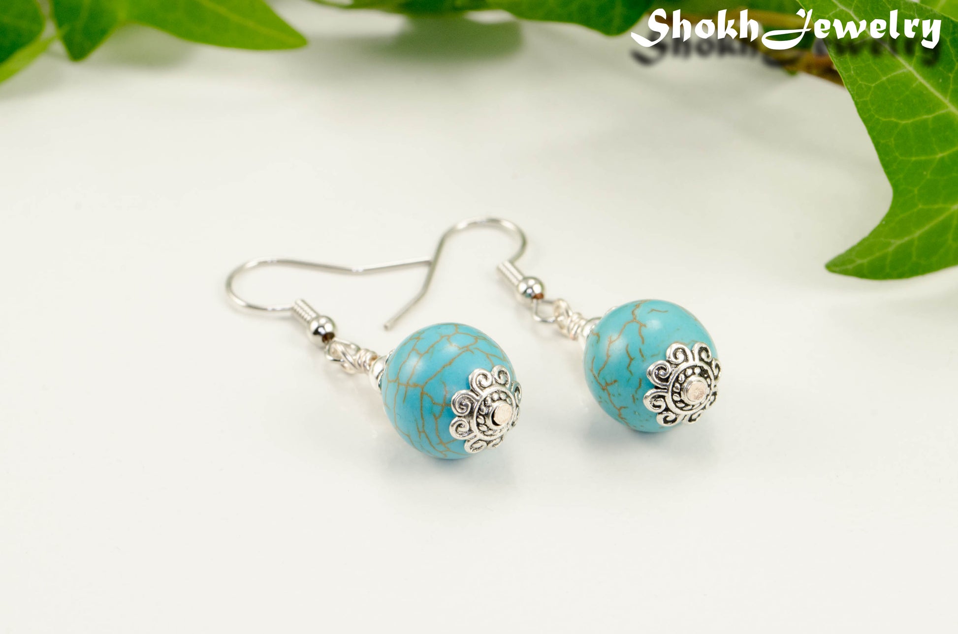 Close up of 12mm Turquoise Howlite Dangle Earrings.