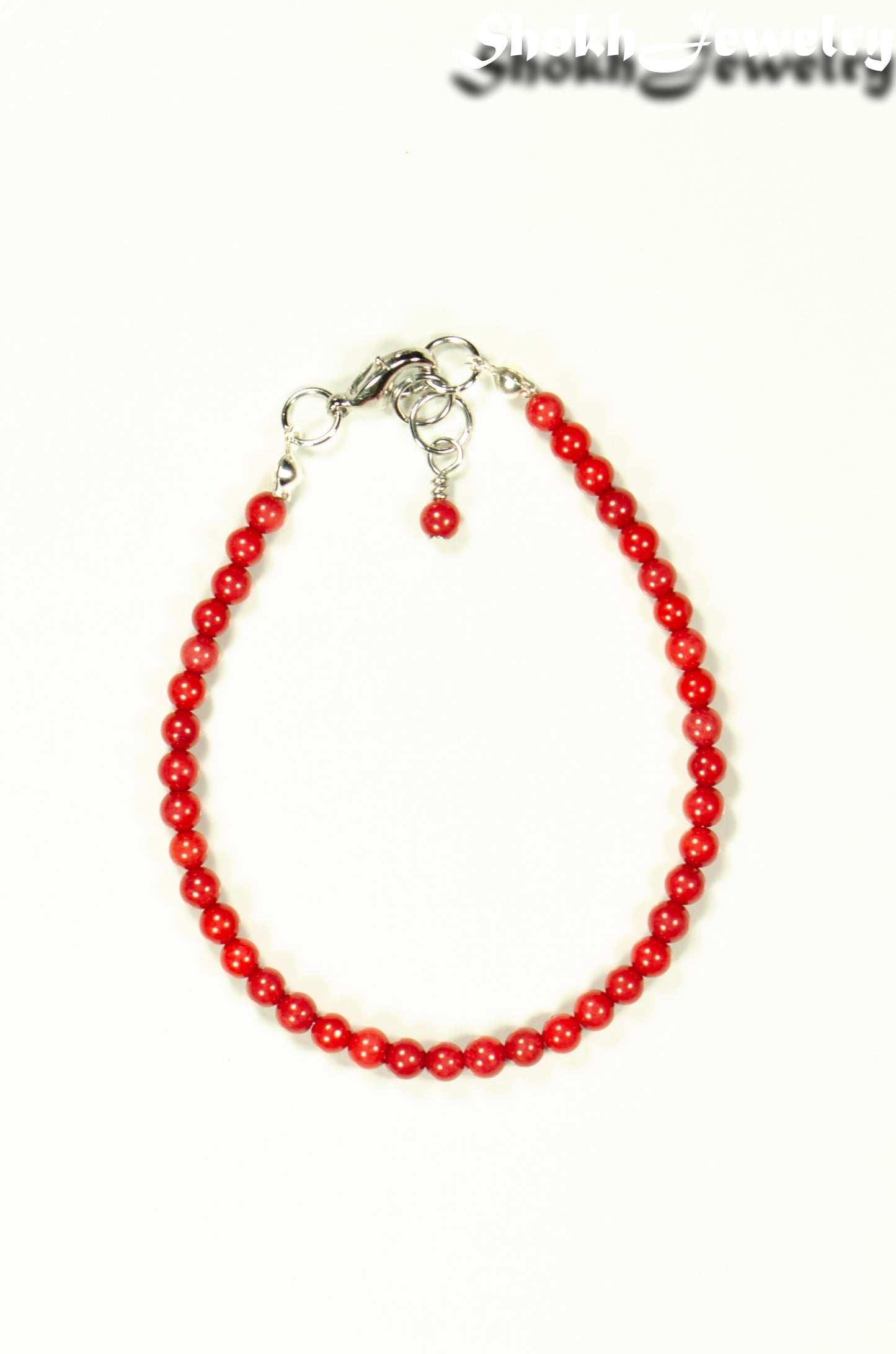 Top view of 4mm Natural Red Coral Bracelet with Clasp.