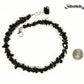 Natural Black Obsidian Crystal Chip Choker Necklace beside a dime.