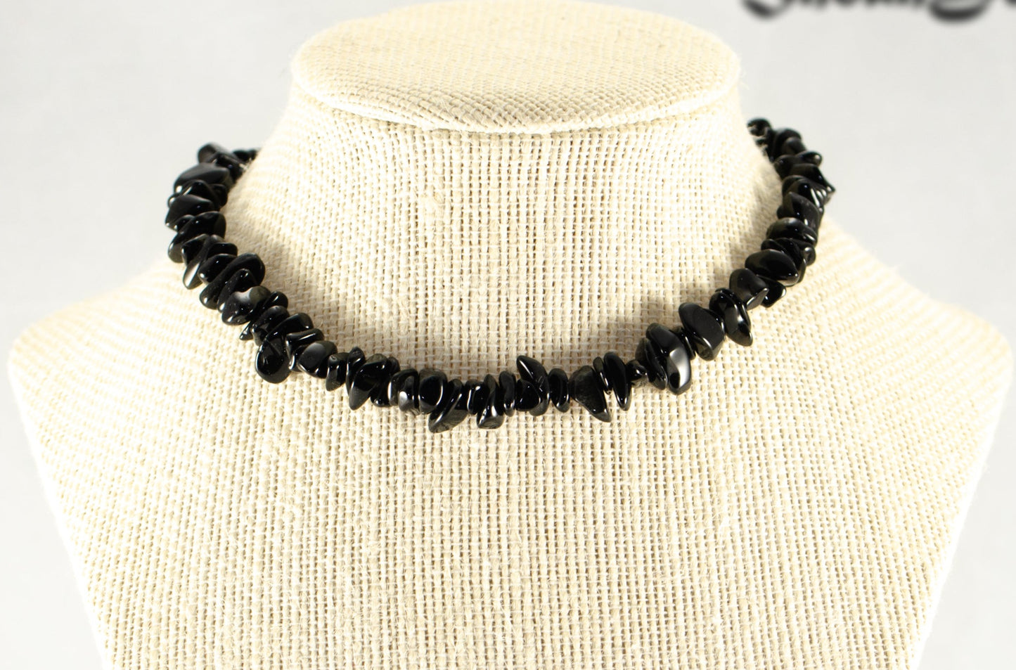 Natural Black Obsidian Crystal Chip Choker Necklace displayed on a bust.