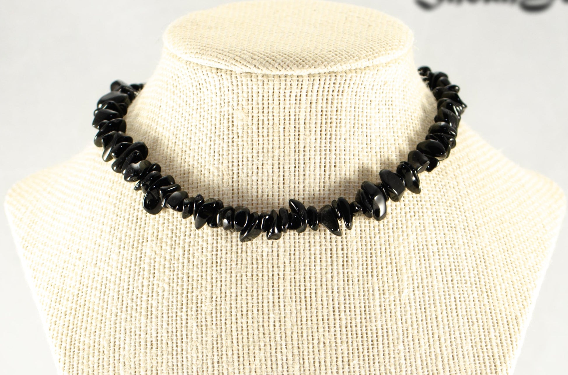 Natural Black Obsidian Crystal Chip Choker Necklace displayed on a bust.