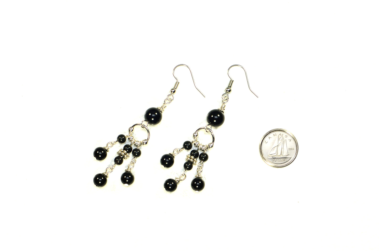 Statement Black Obsidian Chandelier Earrings beside a dime.