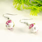 Side view of 12mm Ceramic Pink Flower Earrings.
