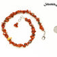 Natural Red Jasper Crystal Chip Choker Necklace beside a dime