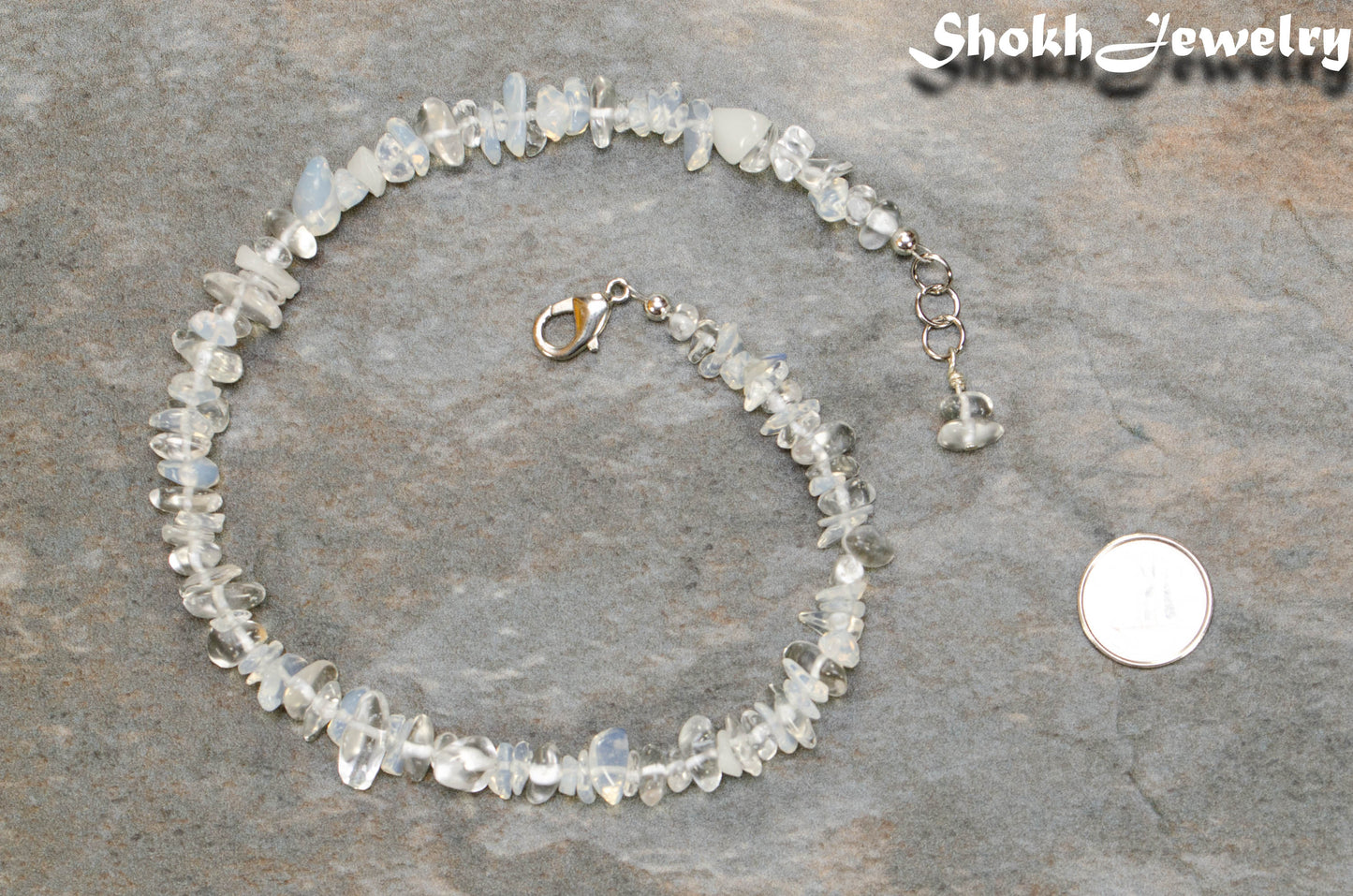 Natural Opal Crystal Chip Choker Necklace beside a dime